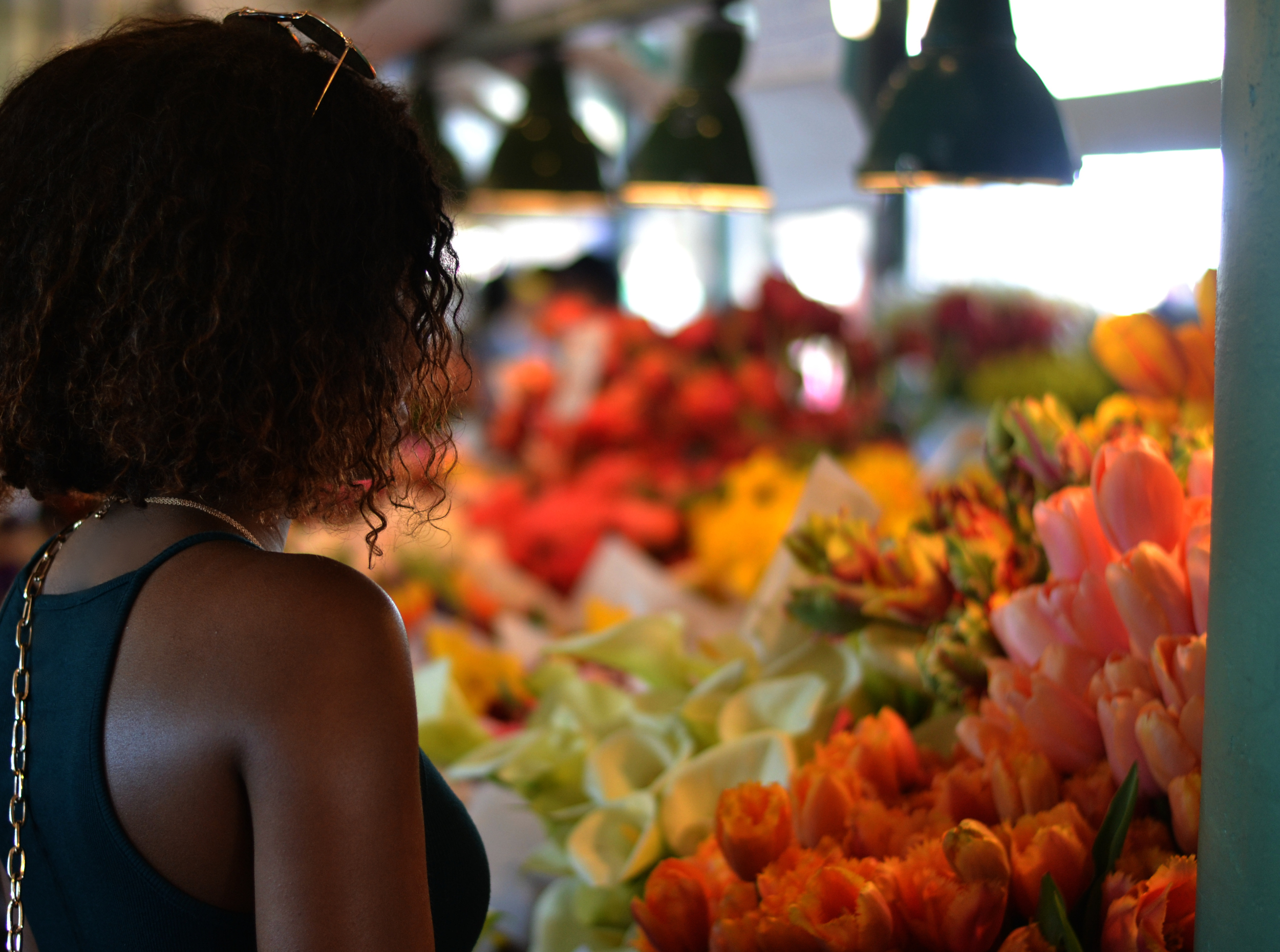 Looking at all of the beautiful flowers inside of Pike Place Market!
